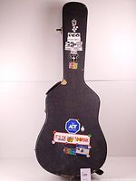 Closed case front showing stickers, latches and wear