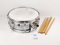 Top view of snare drum with six drumsticks