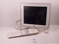 Front view of Apple Studio Display with keyboard