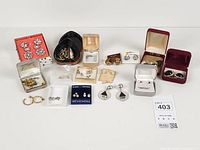 Full lot overview showing all earring boxes and cards