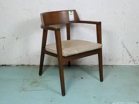 Full view of walnut dining chair front-left angle