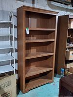 Front view of bookcase showing five shelves and overall style