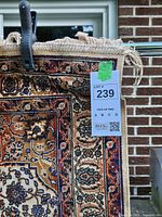 Front corner of rug showing pattern, colours and fringe