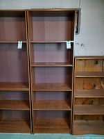 Front view of veneer wood bookcase showing full height and shelves