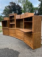 Full lineup of nine modular wooden units showing bases, hutches and top cabinets
