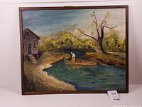 Front view of framed river scene painting
