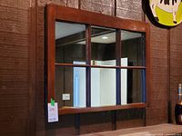 Front view showing entire six-pane wooden framed mirror