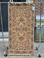 Full view of rug front showing pattern and fringe