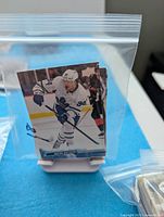 Stack of Toronto Maple Leafs cards in sleeve, front card Auston Matthews Upper Deck