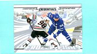 Front of 2024-25 Upper Deck Credentials Frozen Fight Connor Bedard / Auston Matthews card