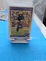 Stack of 2024 Score NFL rookie cards in sleeves, top card J.J. McCarthy