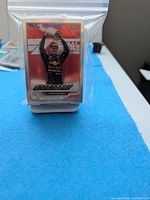 Stack of sleeved Topps Chrome Max Verstappen victory card
