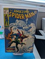 Front cover of The Amazing Spider-Man #74 bagged and on stand