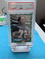 Front of 1986 Topps Ed "Too Tall" Jones card in PSA slab, showing player image and PSA label Grade 7