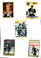 Overall shot of all five Wayne Gretzky trading cards in lot