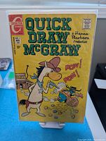 Front cover of Quick Draw McGraw #1 comic in protective sleeve