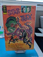 Front cover of Star Trek #24 comic in protective sleeve