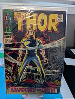 Front cover of The Mighty Thor #145 comic in protective sleeve