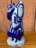 Front view of blue and white salt-glazed Santa figurine