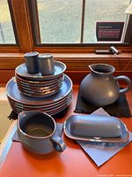 Full group with stacked plates, tumblers, soup bowl, butter dish, pitcher