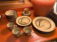 Overview showing entire Denby Savoy set: bowls, plates, cups, saucers