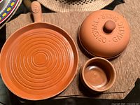 Top view of skillet, lid, bowl