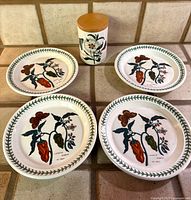 Group shot of all four plates and jar to show completeness and pattern
