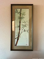 Full view of framed artwork on wall