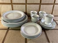 Full set stacked: dinner plates, salad plates, saucers, cups, bowls