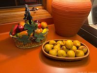 Both wicker baskets with artificial fruit displayed on countertop
