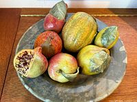 Overhead view of bowl with all seven ceramic fruits