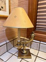 Full view of Stiffel brass French-style table lamp with conical shade