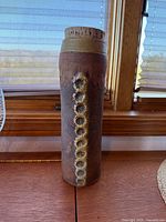 Front view showing vase height, texture and lid