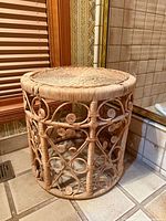Full view of cylindrical wicker rattan stand front angle