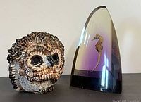 Ceramic owl and resin seahorse paperweight front view