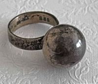 Ring with ball bell showing band and stamp