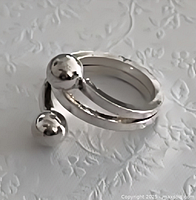 Perspective view of bypass ring showing twin ball terminals and wrap design