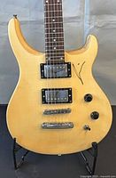 Front view showing body, pickups, controls, signature