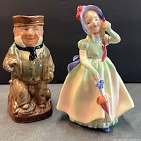 Front view of Babie figurine and Toby jug