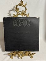 Front of album jacket on stand, showing AC/DC logo and title