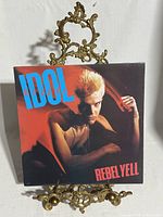 Front cover of Billy Idol Rebel Yell LP on display stand