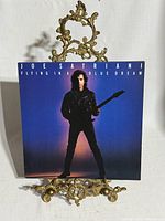 Front album cover on stand