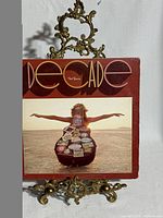 Front cover of Neil Young "Decade" 3-LP album on stand