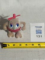 Front view with tape measure for scale