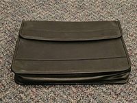 Front view of closed black padfolio