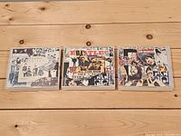 Front view of three Beatles Anthology clamshell CD sets
