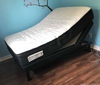 Mattress on adjustable base with head raised