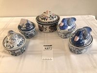 Group shot of all five blue and white lidded dishes