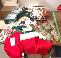 Overall view of lot showing stockings, rattan balls, toppers, picks and ornaments