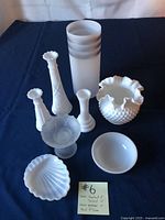 Group shot of eight milk glass pieces